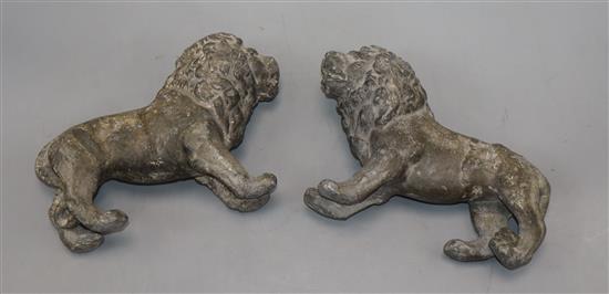 A pair of 19th century solid lead medals of lions rampant length 20cm